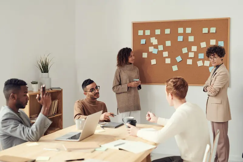 Team sketching a system on a whiteboard